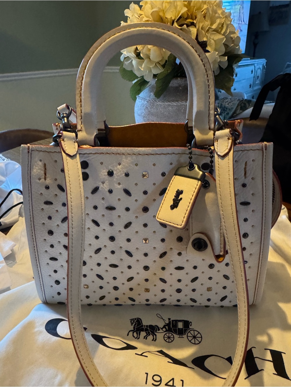 Coach Rogue 25 with prairie rivets.  Genuine Glove-tanned pebble leather.